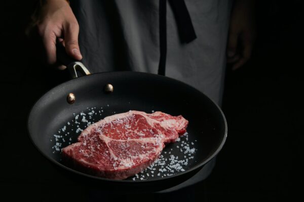 Steak searing in pan Steak searing in pan